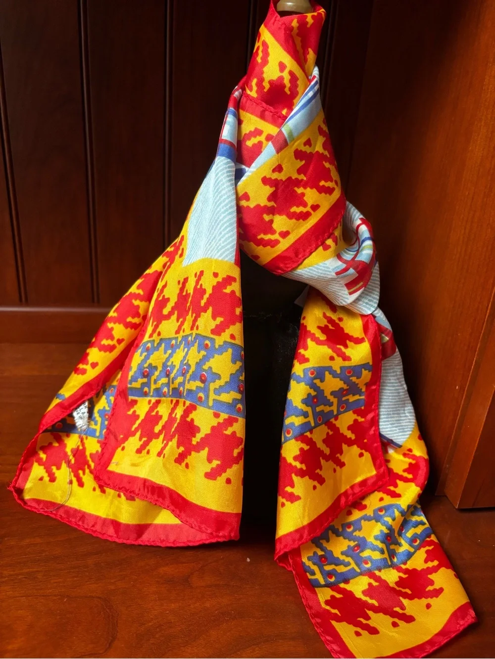 vibrant red and yellow houndstooth pattern scarf